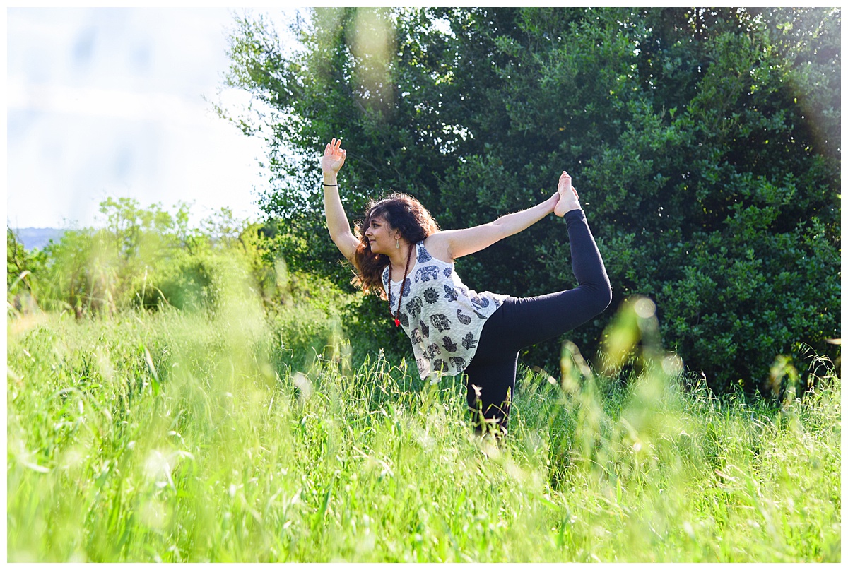yoga instructor posing in a green meadow at Cuesta Park, Mountain View, CA