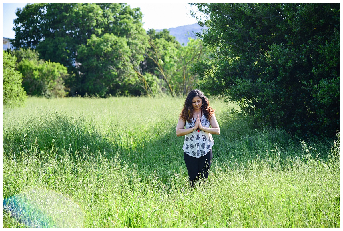 yoga instructor posing in a green meadow at Cuesta Park, Mountain View, CA