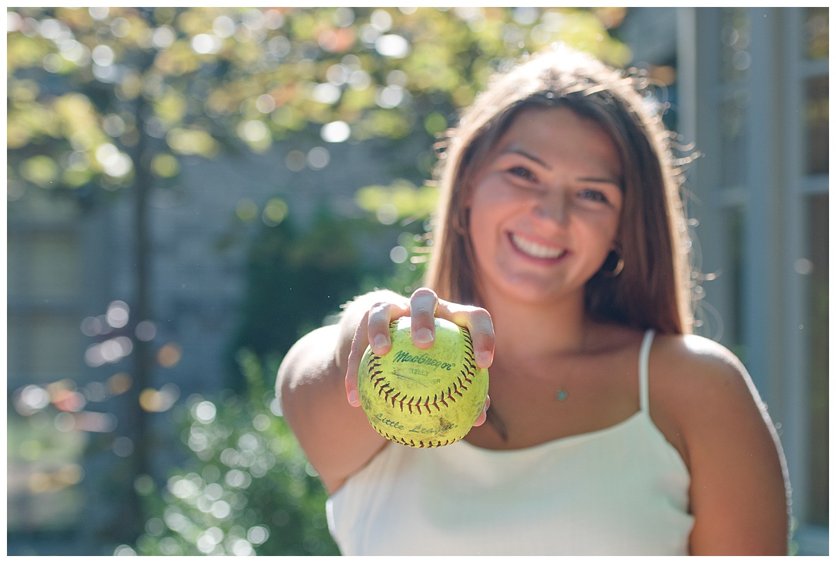 Senior portrait of a 2020 senior holding a softball