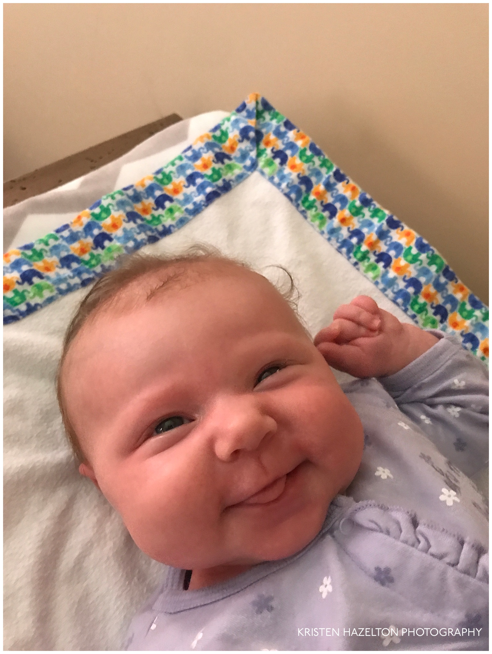 Smiling one month old baby