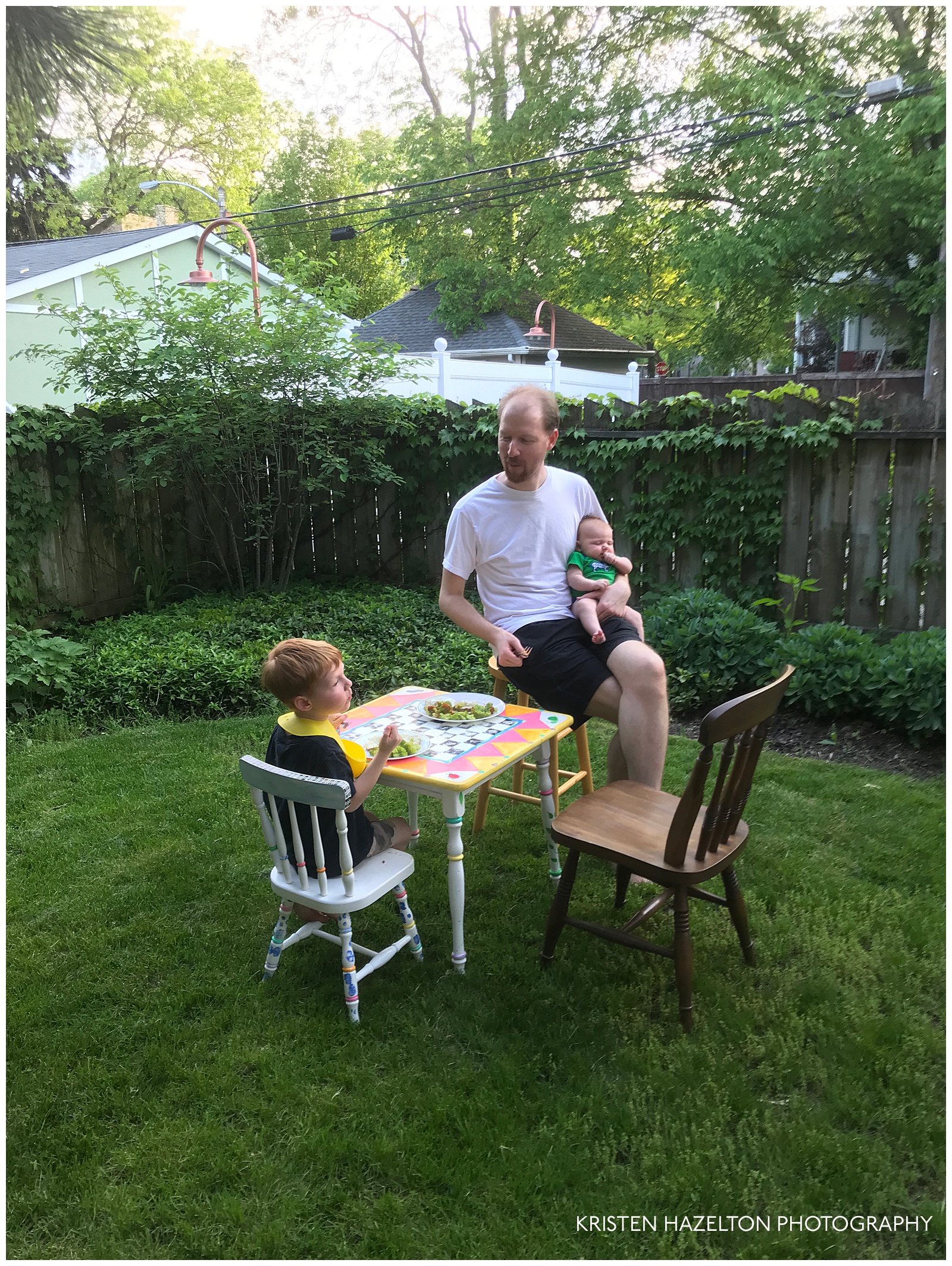 Family dining outdoors on a very small table