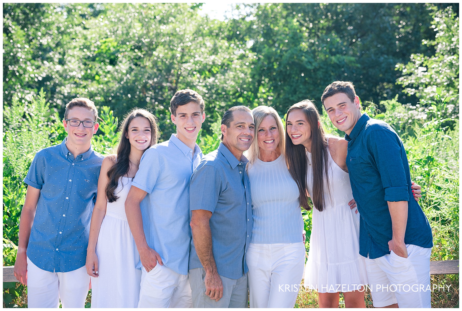 Family of seven hugging in close for river forest il family photos