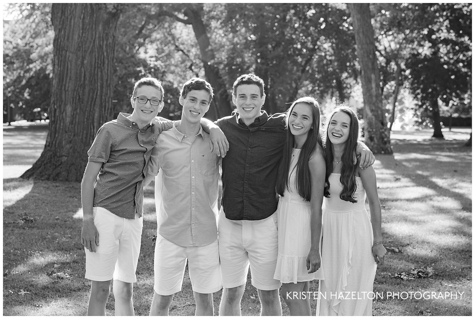 Black and white photo of five teenage siblings for river forest il family photos