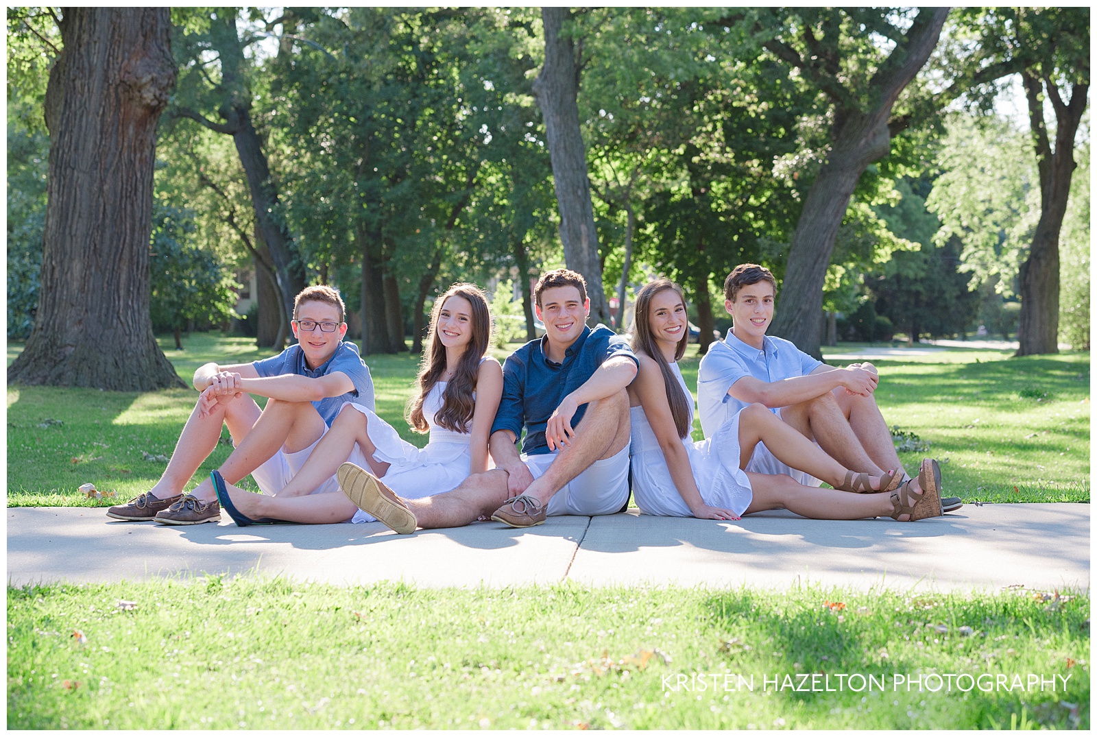 five siblings sitting in the sunshine for river forest il family photos