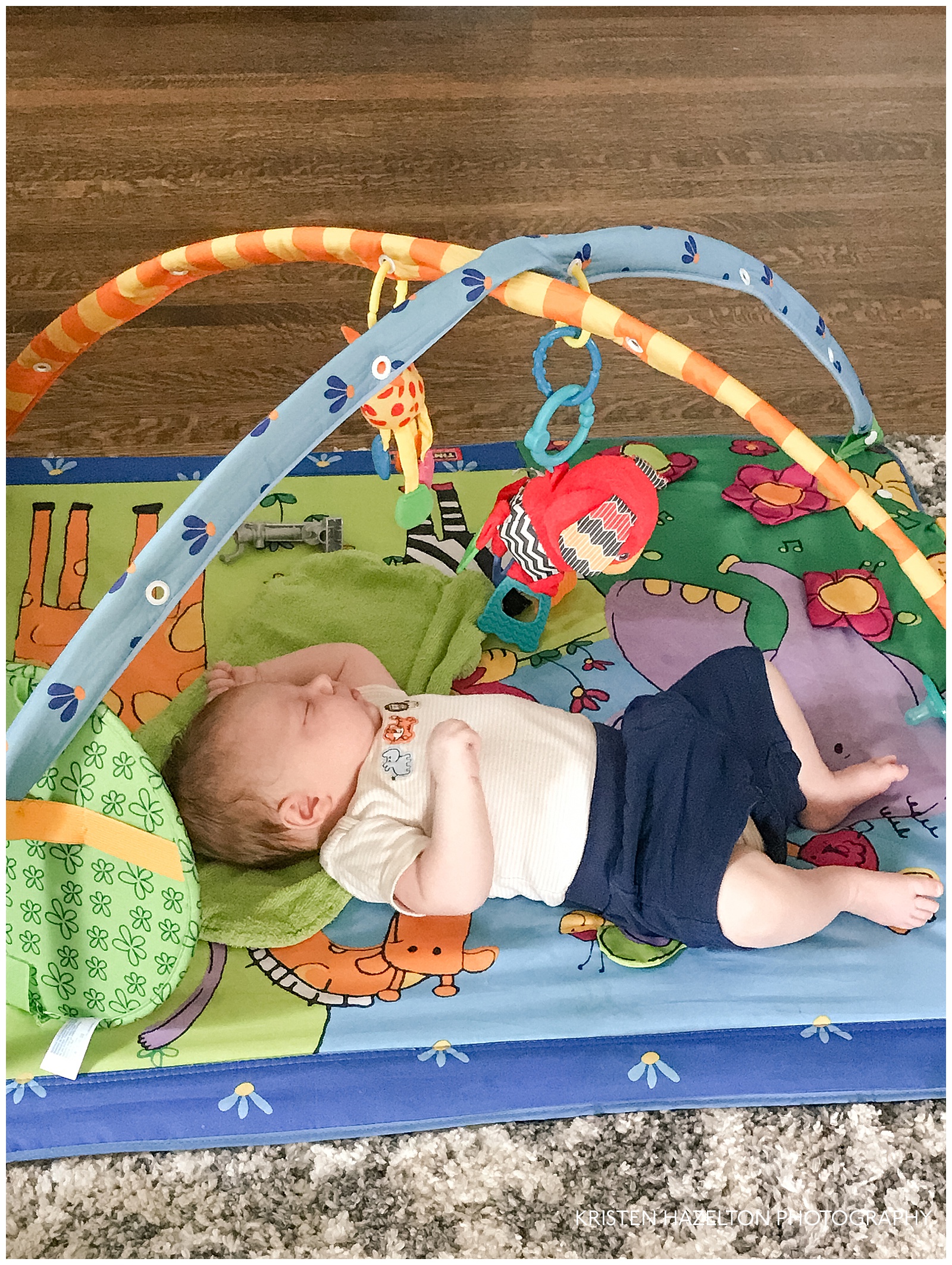 Baby sleeping on a play mat