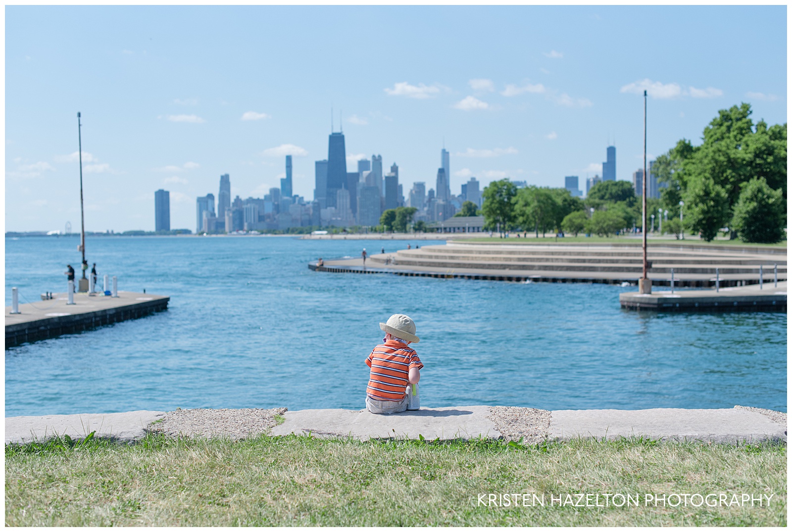 Toddler sitting on steps overlooking Lake Michigan and the Chicago skyline