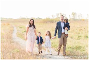 Family of five walking in Miller Meadow in River Forest, IL