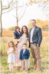 portrait of a young family of five in Miller Meadow in Forest Park, IL