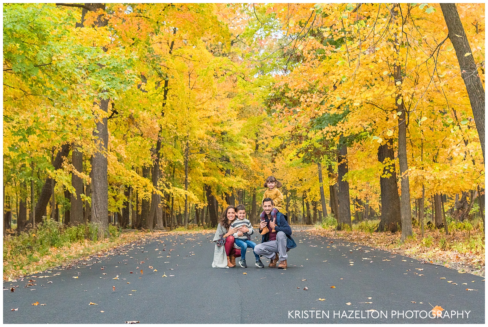 Fall portraits of a young family of four in Thatcher Woods in River Forest, IL
