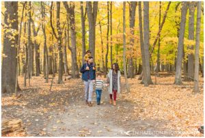 Fall portraits of a young family of four in Thatcher Woods in River Forest, IL