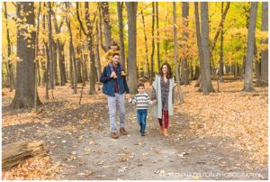 Fall portraits of a young family of four in Thatcher Woods in River Forest, IL