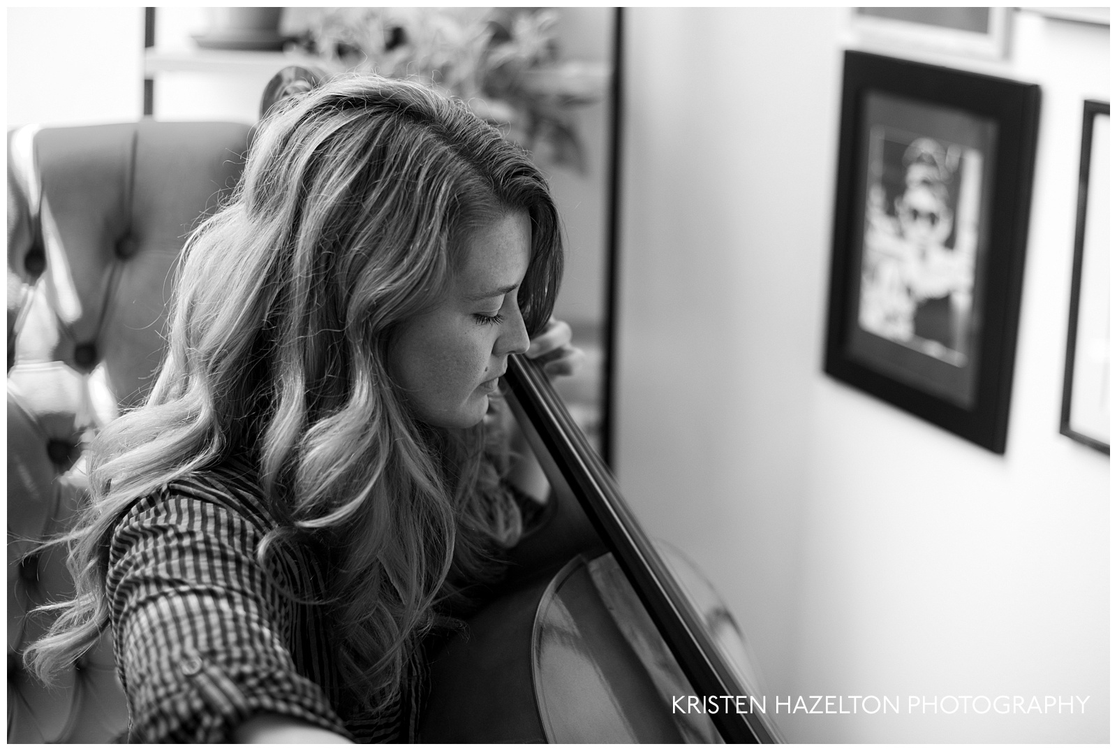 black and white portrait of a redheaded woman playing a cello
