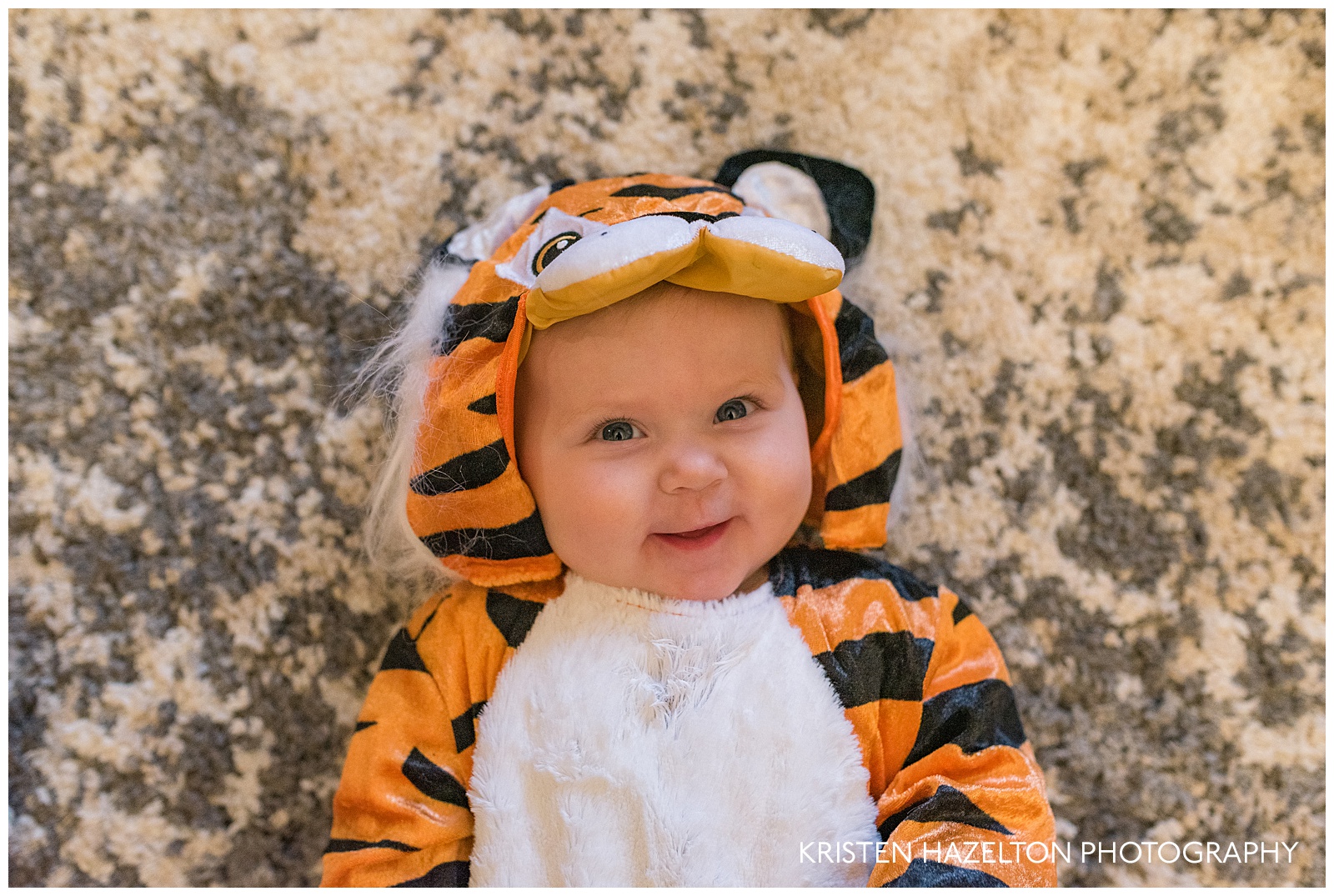 Baby dressed in a tiger costume