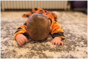 Baby dressed in a tiger costume