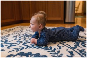 Smiling 6 month old baby in profile