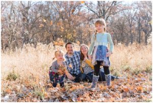 Fall family portraits with leaf throwing at Thatcher Woods, River Forest, IL