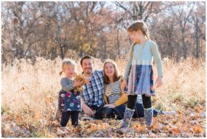 Fall family portraits with leaf throwing at Thatcher Woods, River Forest, IL