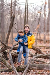 Family portrait of a father and son playing in Thatcher Woods, River Forest, IL
