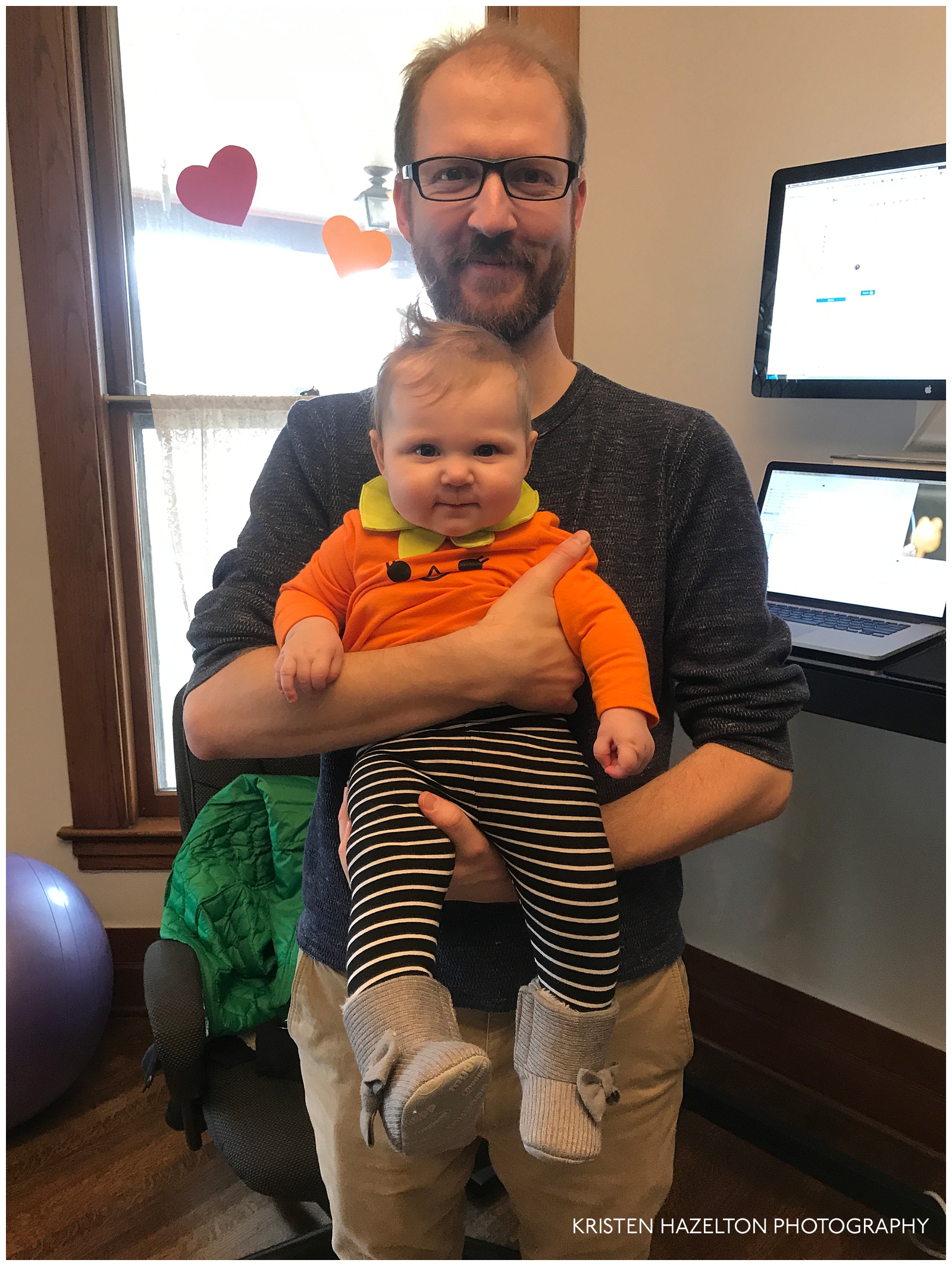 Baby in a pumpkin outfit with new gray boots