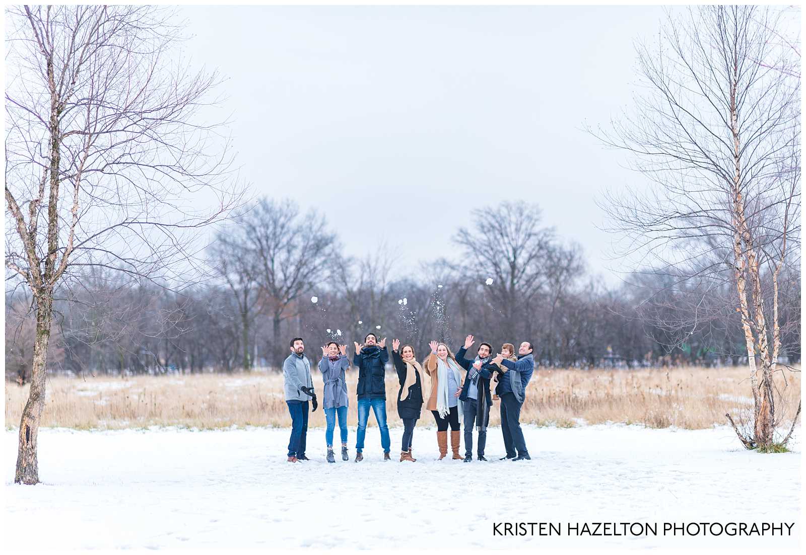 snowy Extended family photo of family throwing snowballs