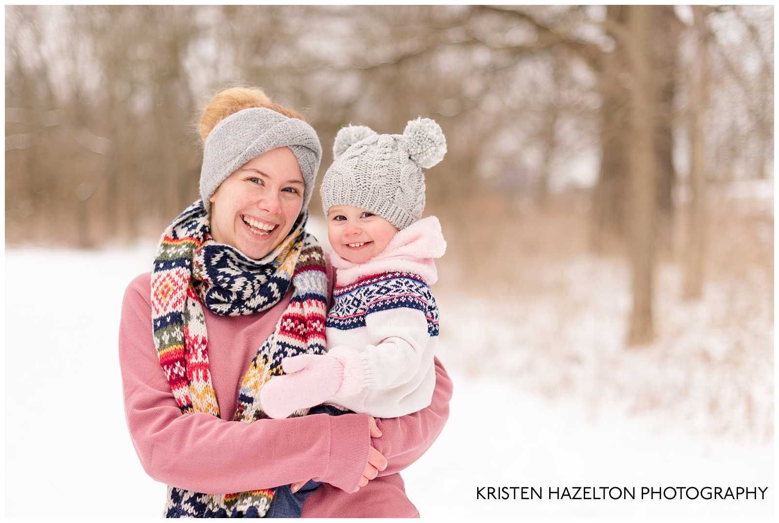 Snowy photo of a Mom and toddler daughter
