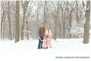 Family of five in the snowy woods