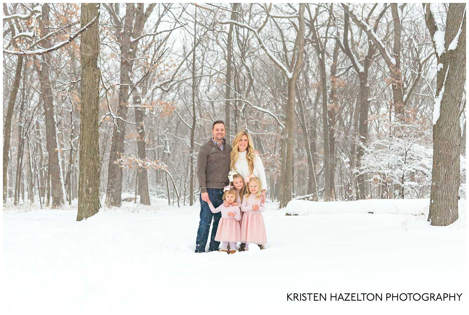 Family of five at a snowfall photoshoot