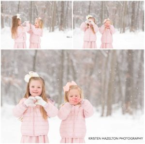 Two sisters making hearts with their hands