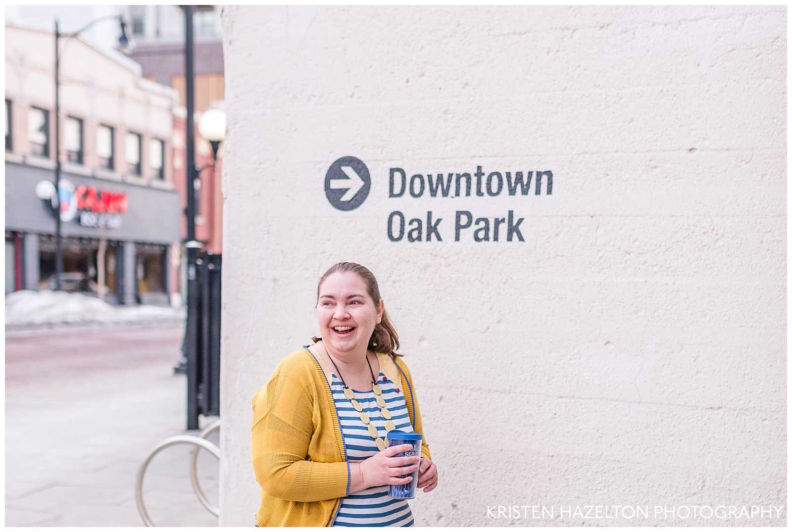 Woman in yellow cardigan walking in downtown Oak Park, IL