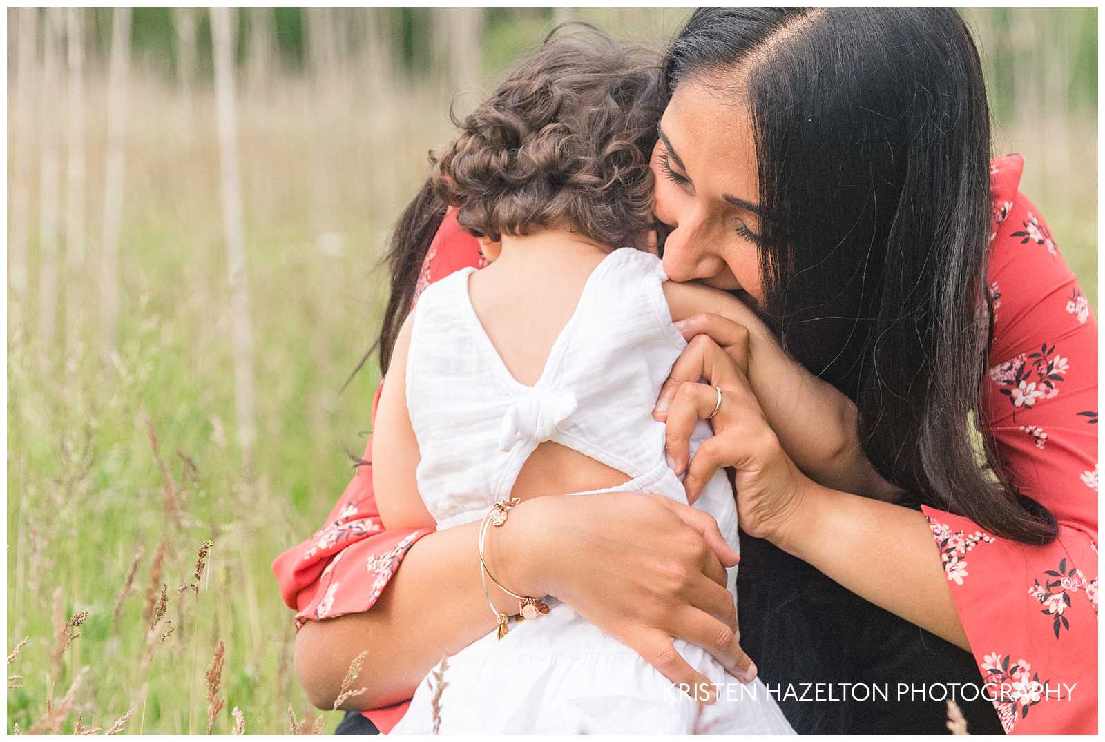 Photo of a toddler girl snuggling with her mother by Forest Park, IL photographer Kristen Hazelton