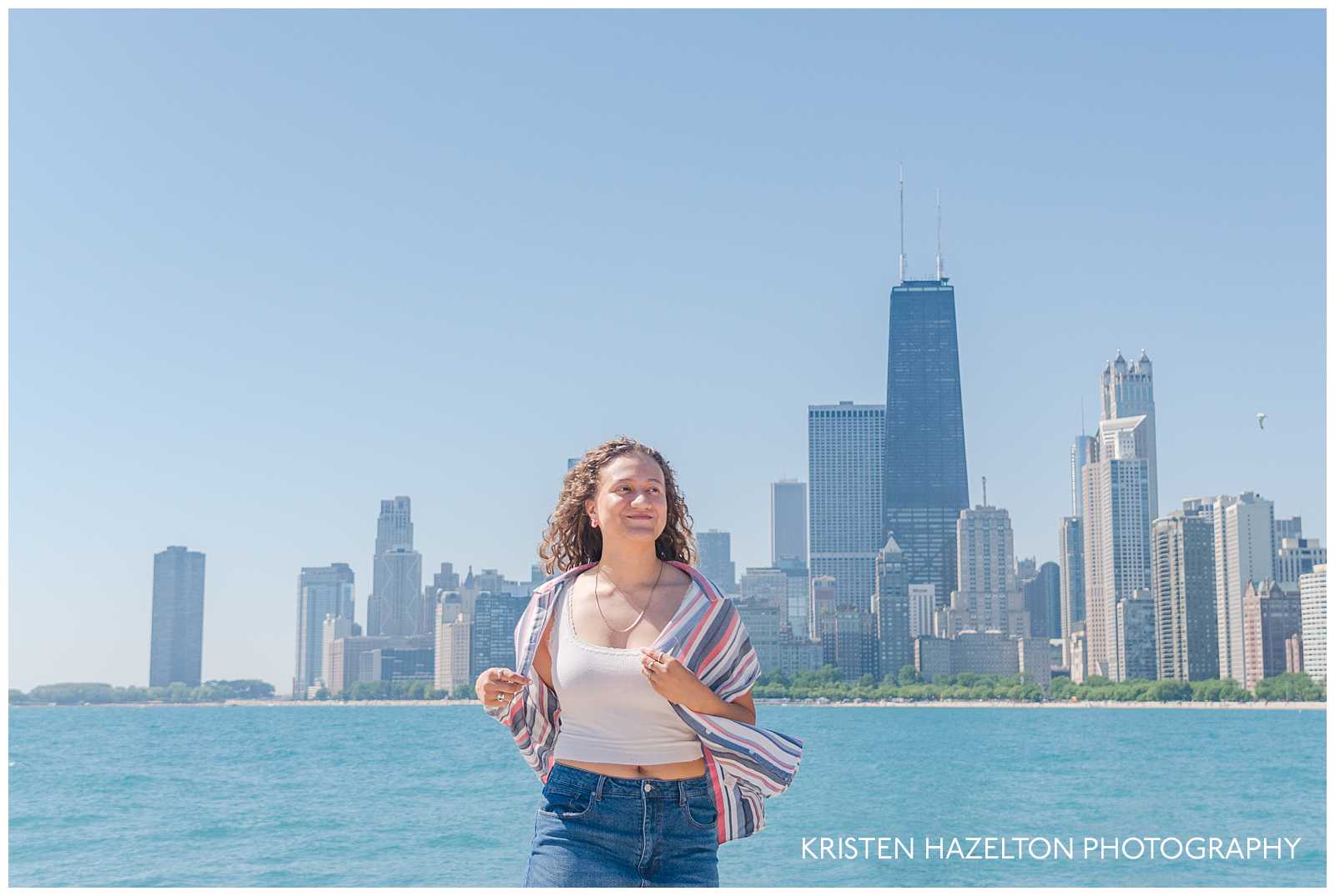 High school senior girl standing in front of the Chicago city skyline