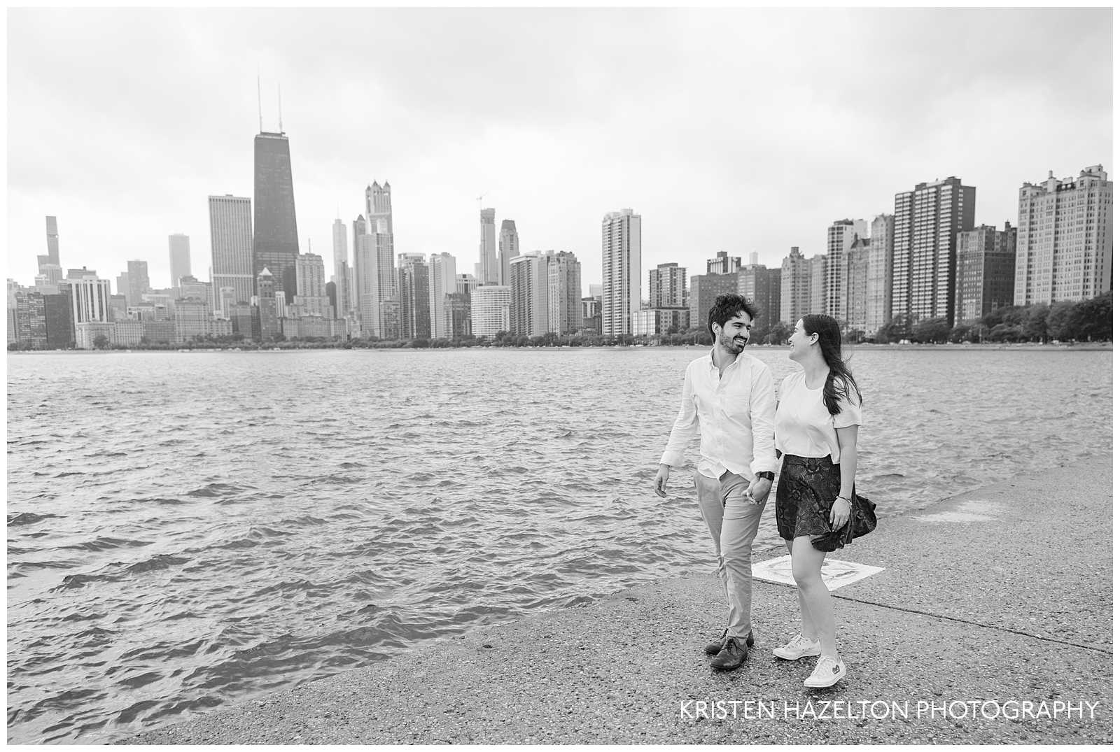 newly engaged couple during a stormy surprise proposal at North Avenue Beach