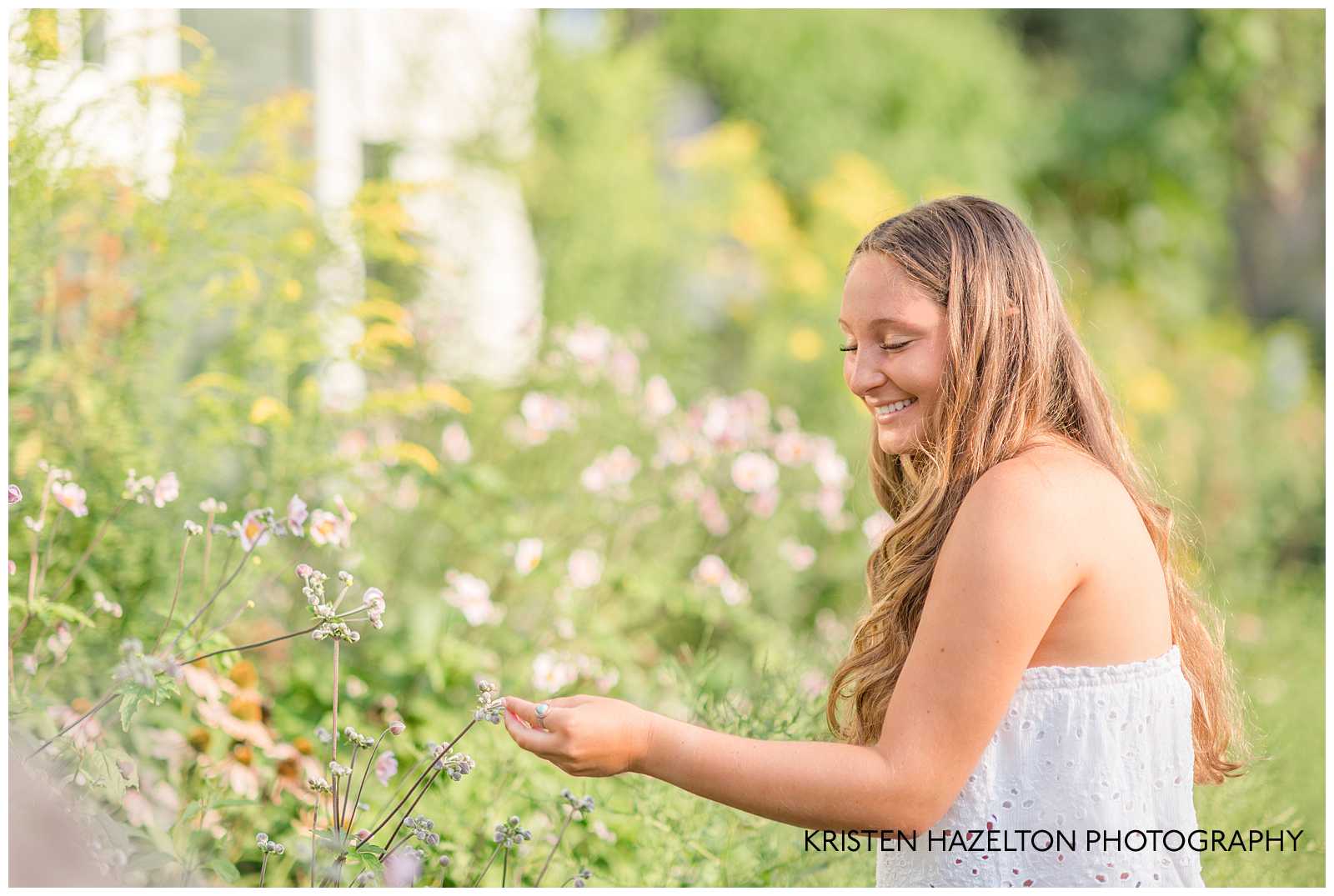 Girl touching a flower for her OPRF Senior Pictures 