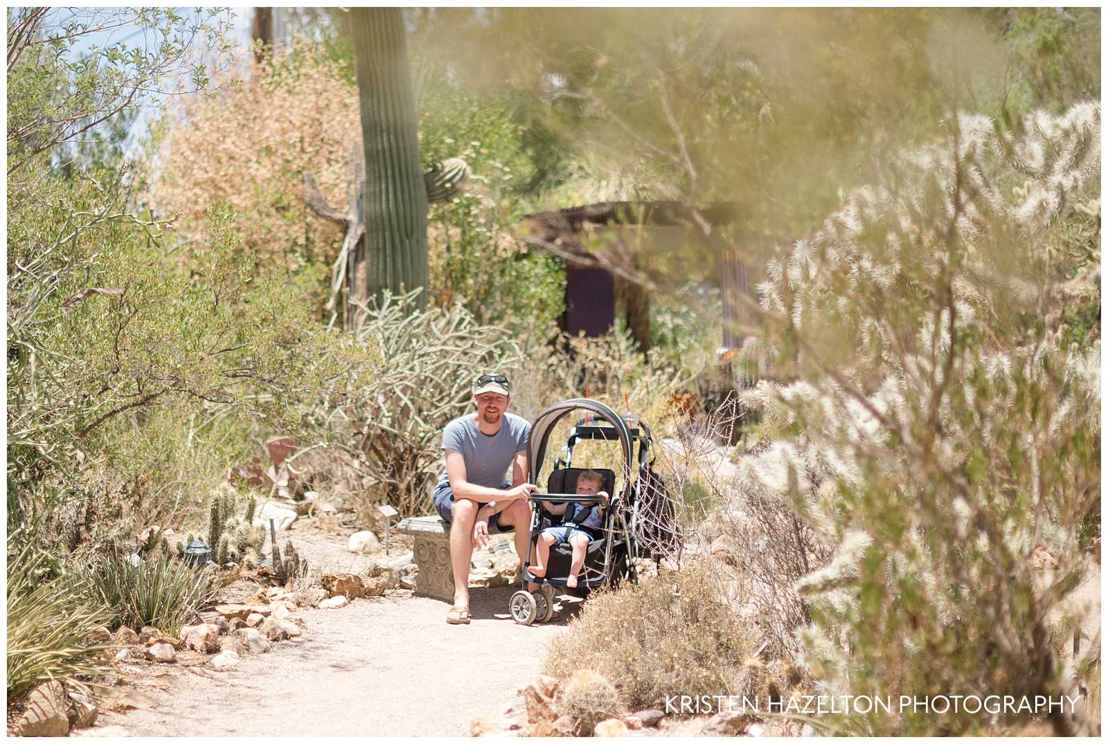 Father and baby daughter sitting at the Tucson Botanical Garden