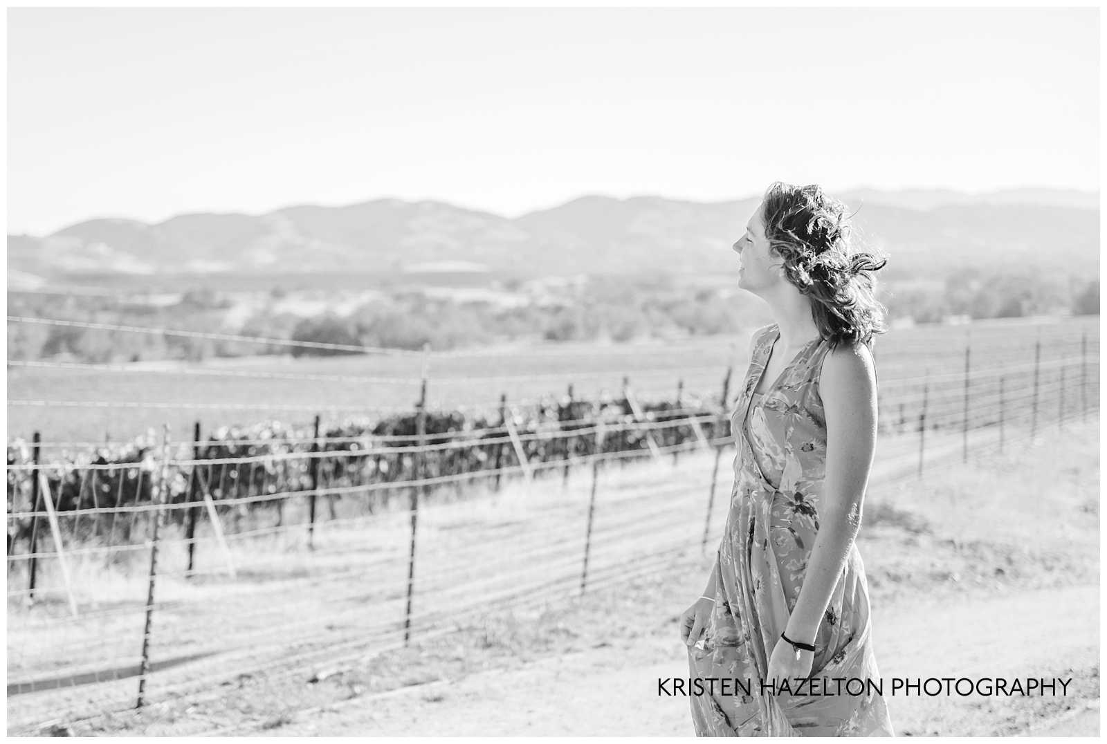 Black and white photo of a girl looking at the Livermore, CA hills