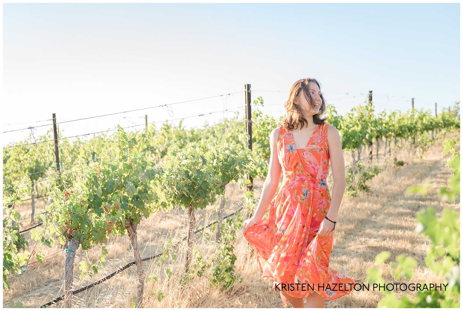 High school senior girl walking through a vineyard by Livermore photographer Kristen Hazelton