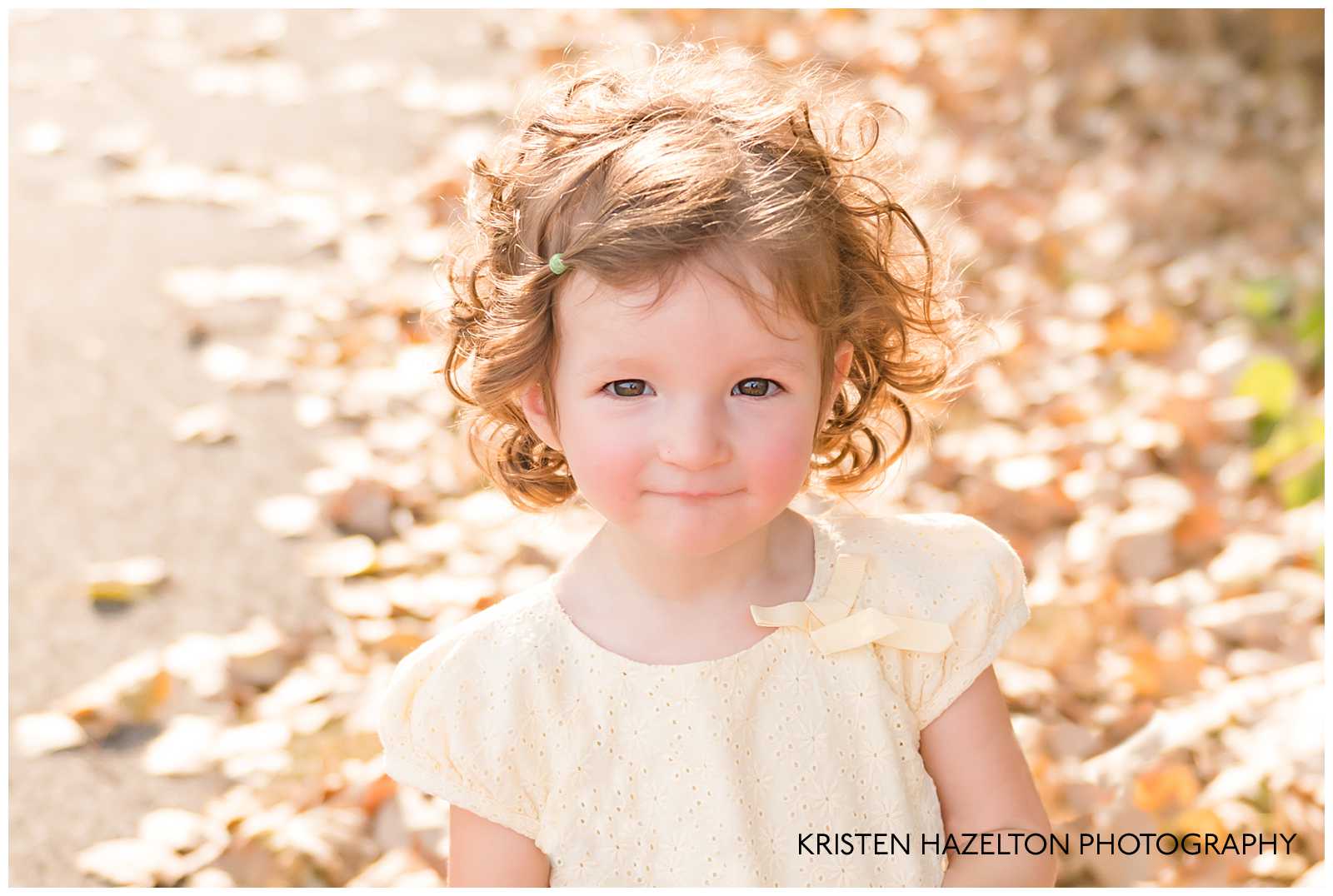 Toddler girl in yellow dress by Elmwood Park, IL photographer Kristen Hazelton