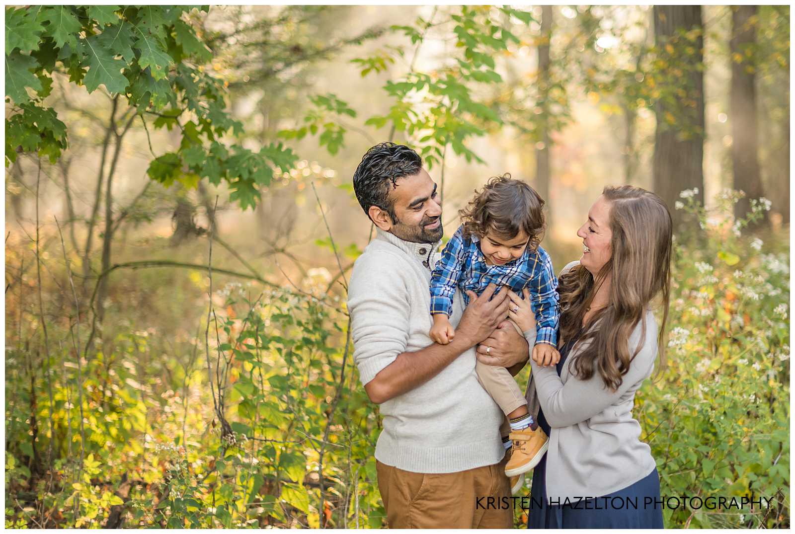 Mom and Dad tickling their toddler son by River Forest, IL family photographer Kristen Hazelton