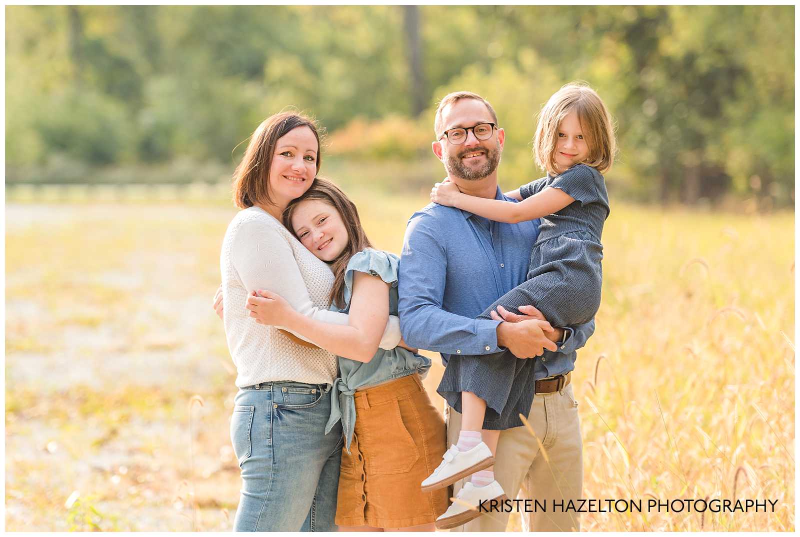 family of four in a field of cattails by River Forest, IL photographer Kristen Hazelton