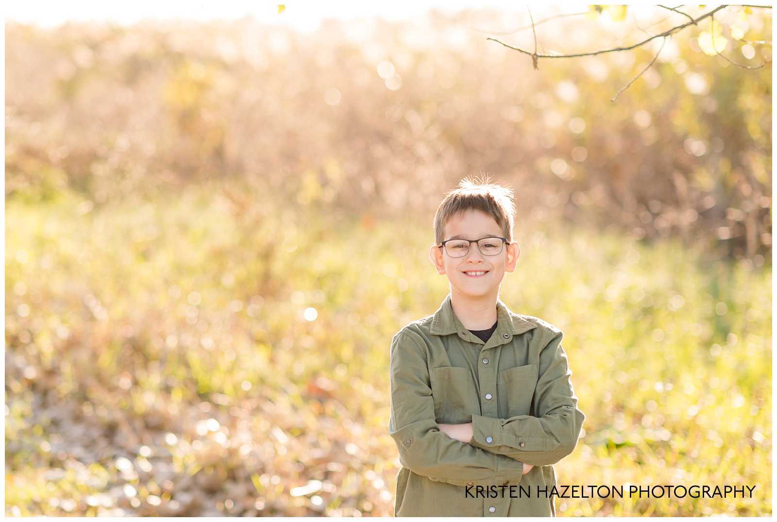 Young boy with his arms crossed by Oak Park, IL and Brookfield IL photographer Kristen Hazelton