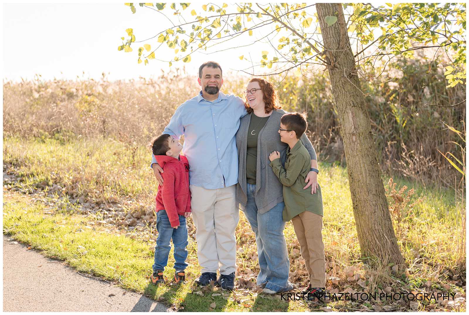 Family of four looking at Dad and laughing by Oak Park, IL and Brookfield IL photographer Kristen Hazelton