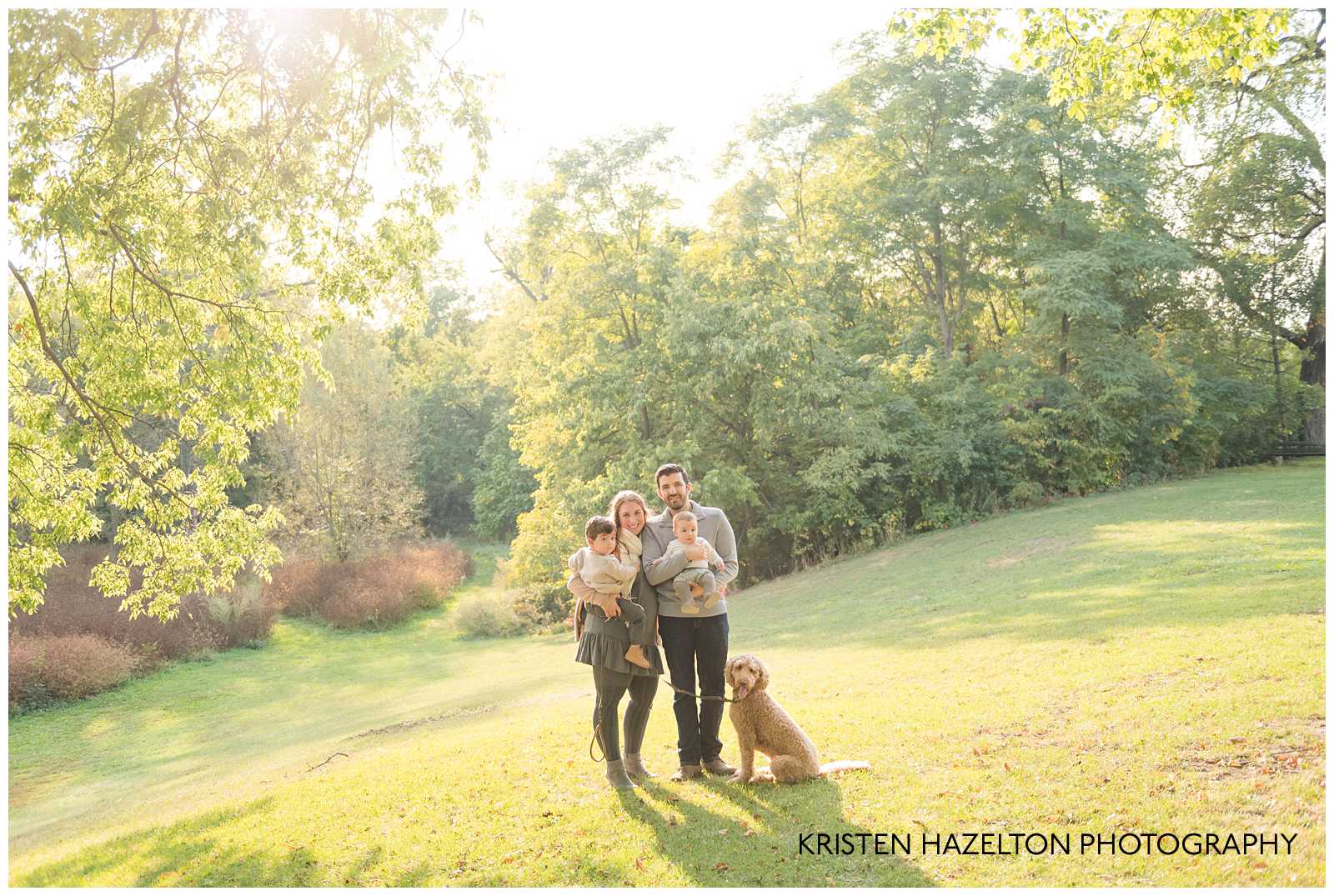 Young family of four at a meadow by Riverside, IL photographer Kristen Hazelton