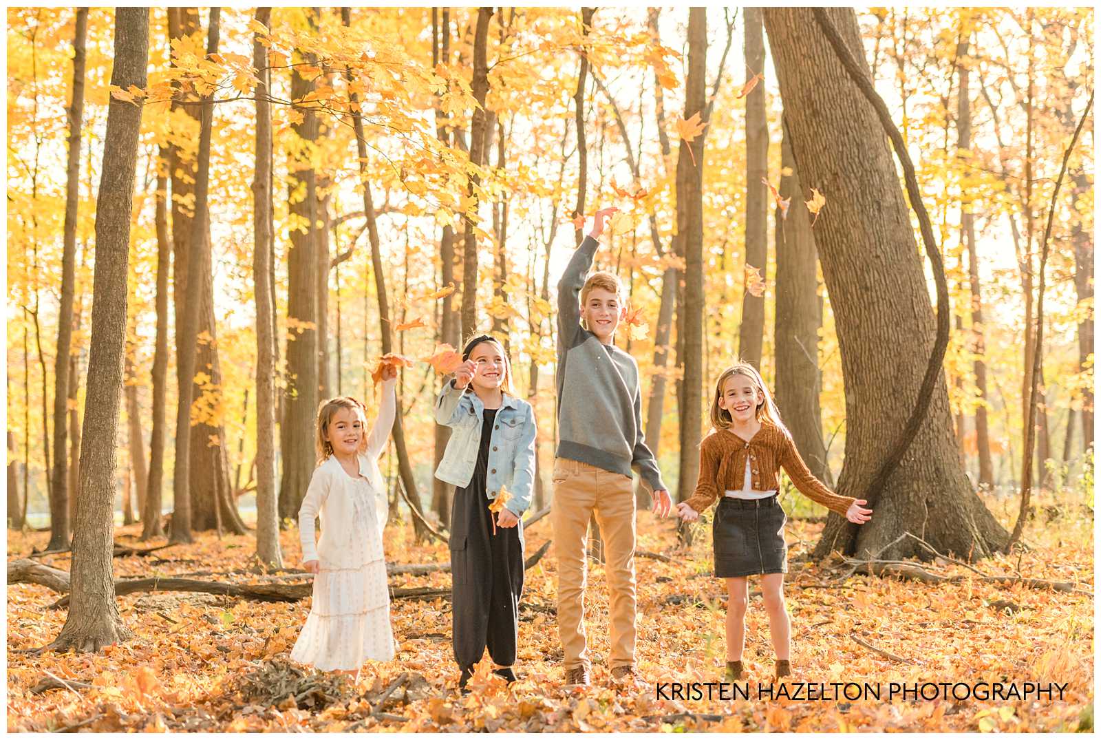 Four children throwing leaves at photographer Kristen Hazelton's River Forest IL Fall Mini Sessions