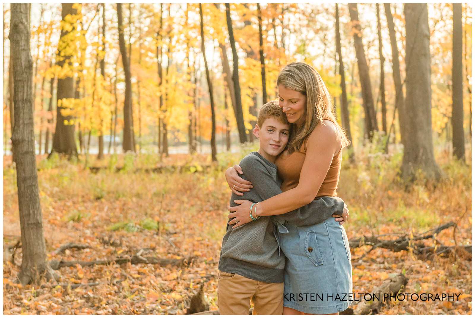 A teen boy hugs his mom at photographer Kristen Hazelton's River Forest IL Fall Mini Sessions