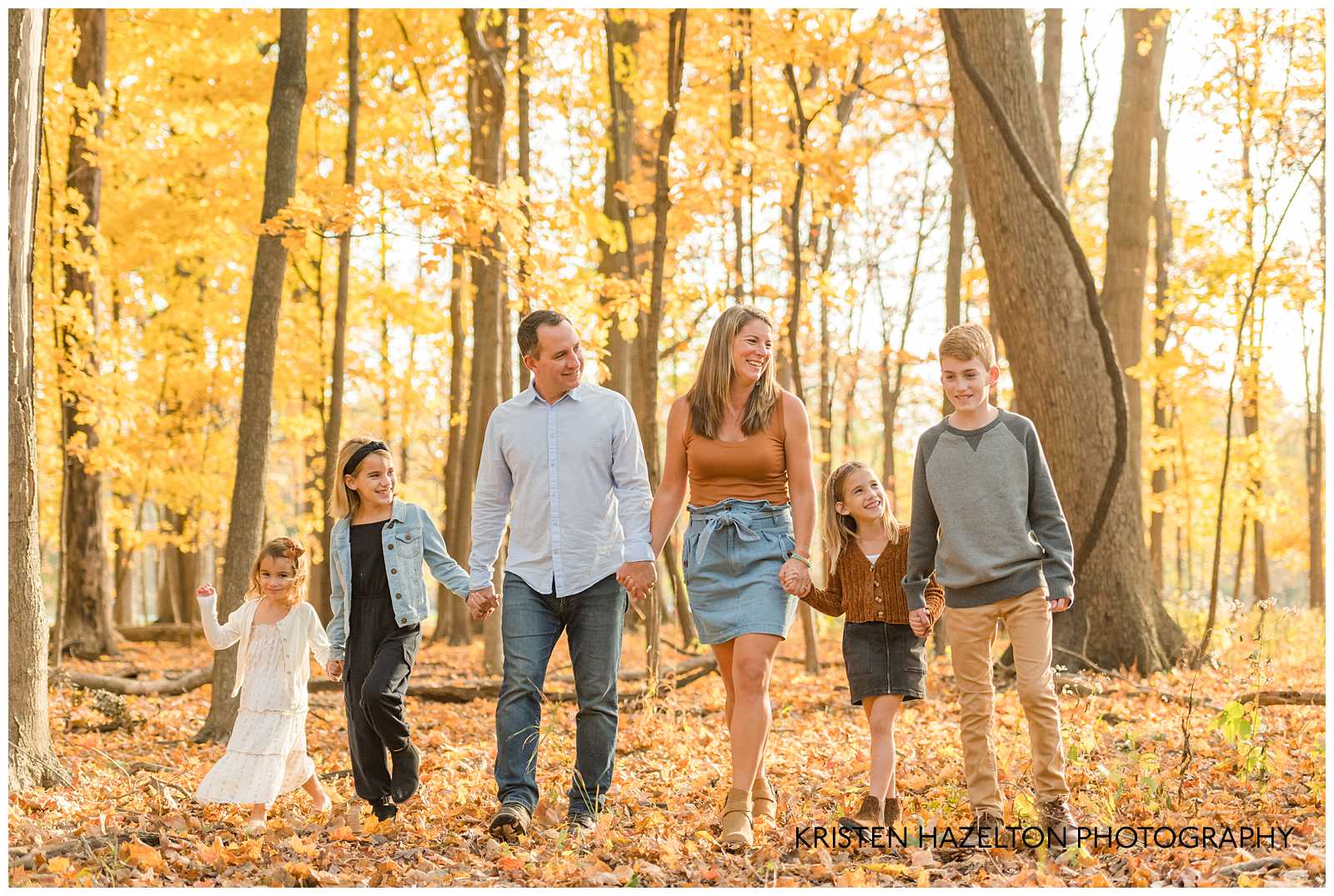 Family of six walking in the woods