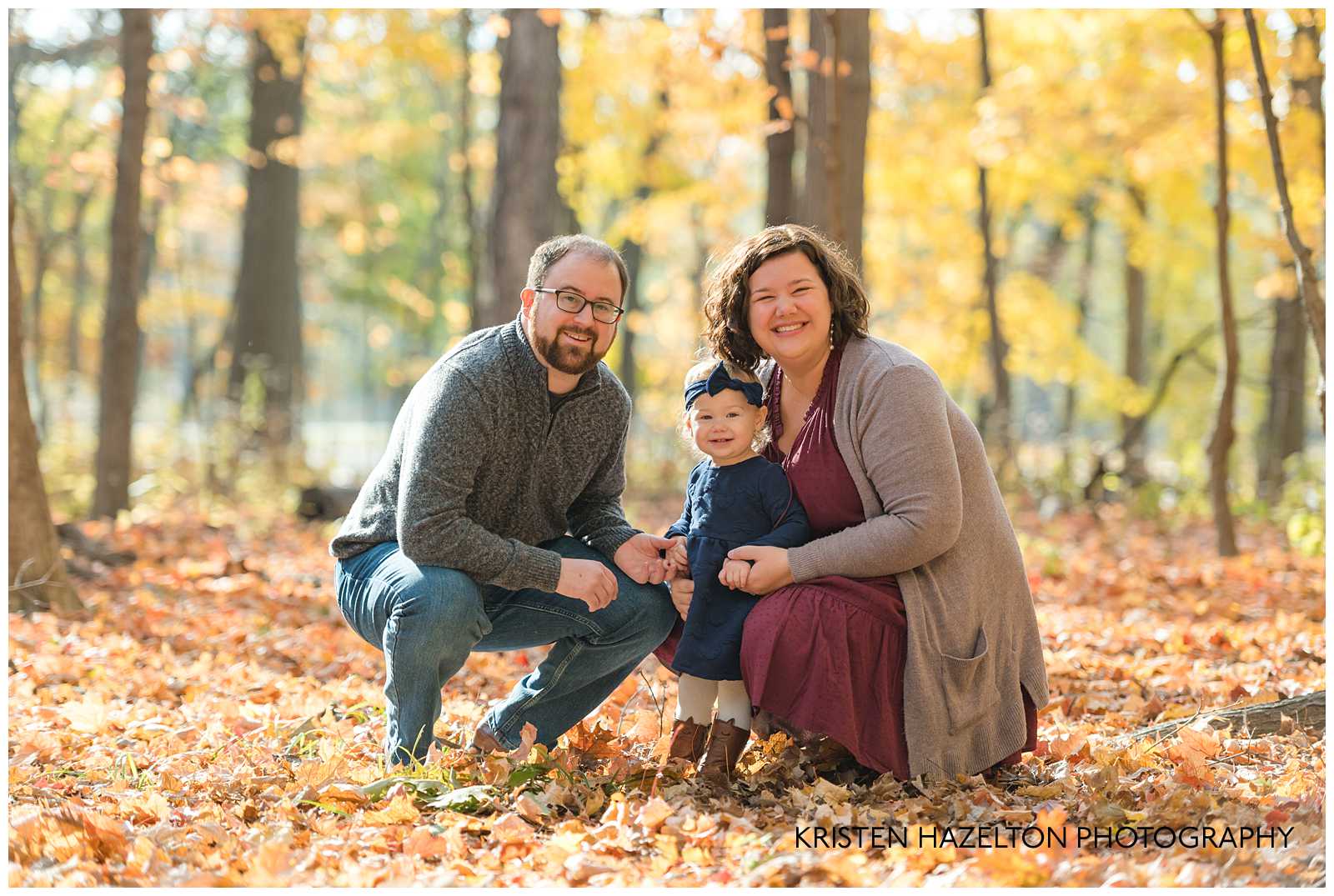 Mom, Dad and daughter in the woods for an Oak Park IL Mini Session
