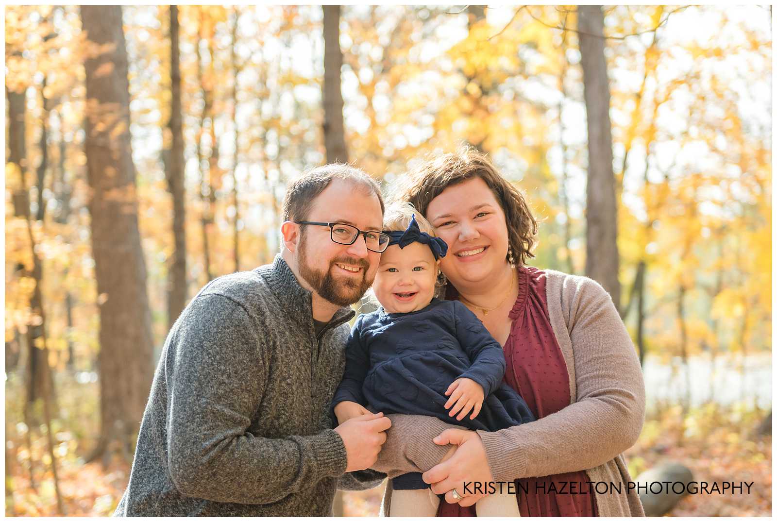 Mom and Dad holding their toddler daughter at a Oak Park IL Mini Session