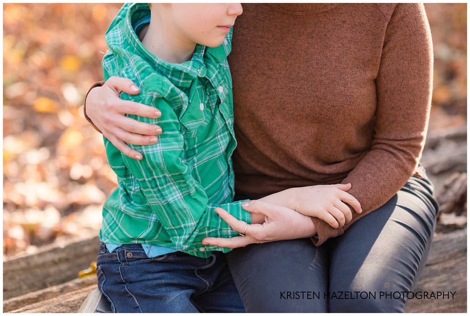 Son quietly hugging his mom at their River Forest IL Fall Mini Session