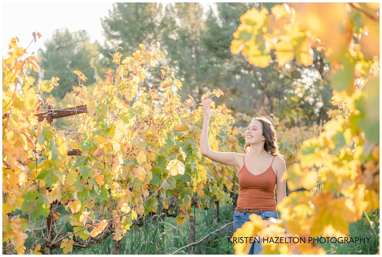 Girl walking through a vineyard by Livermore Senior Photographer Kristen Hazelton
