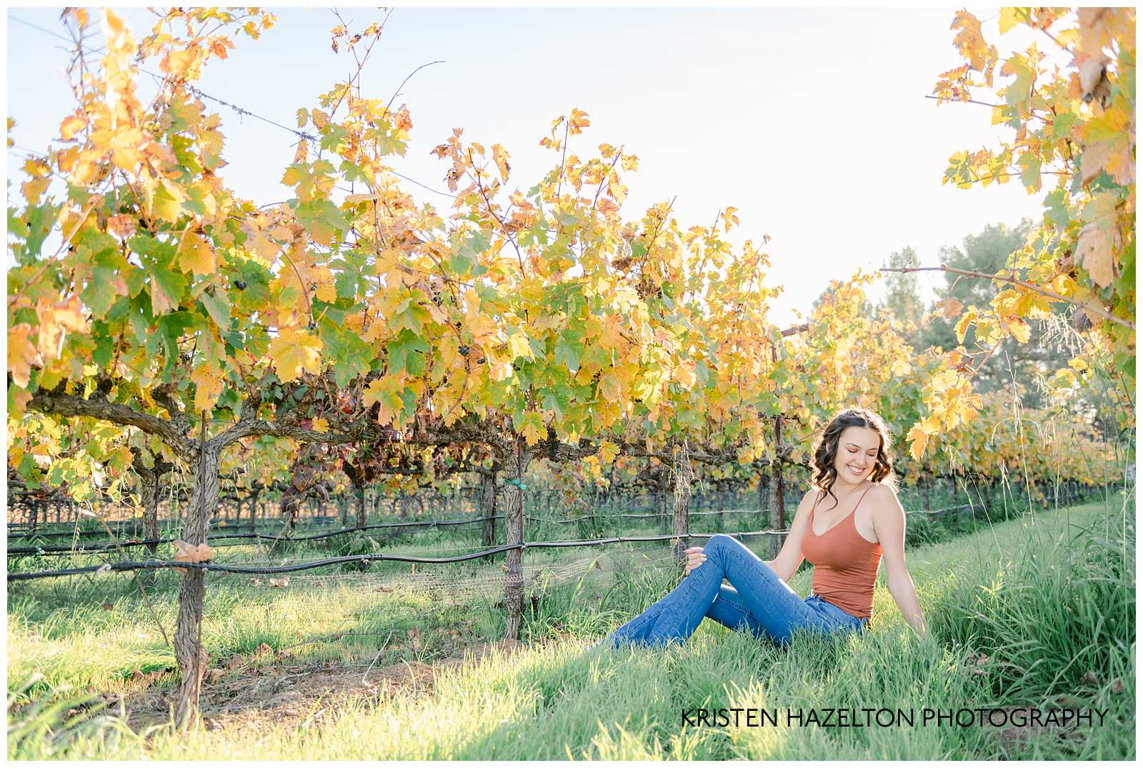 Girl sitting in a vineyard by Livermore Senior Photographer Kristen Hazelton